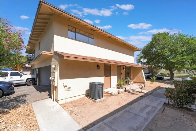 1407 Dorothy Ave Unit 2, Las Vegas, NV 89119 - back of house featuring stucco siding and a garage