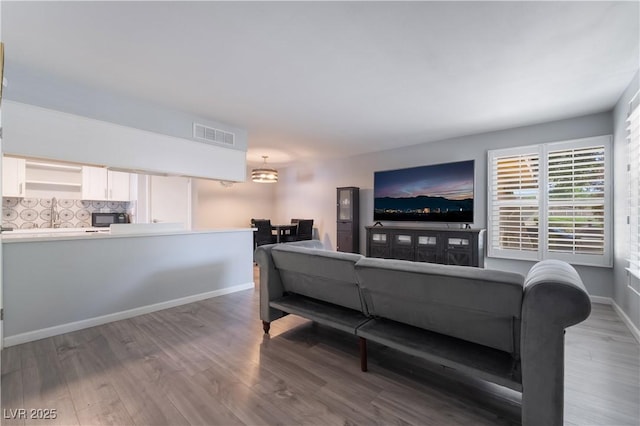 1407 Dorothy Ave Unit 2, Las Vegas, NV 89119 - living area featuring wood finished floors and baseboards