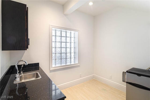 1319 Red Baron Ln, Boulder City, NV 89005 - kitchen featuring healthy amount of natural light, recessed lighting, stainless steel refrigerator, and dark stone countertops