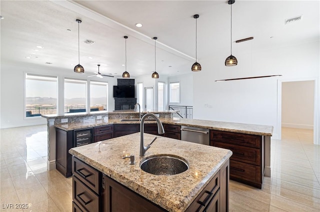 1319 Red Baron Ln, Boulder City, NV 89005 - kitchen with a spacious island, healthy amount of natural light, ceiling fan, dishwasher, and recessed lighting