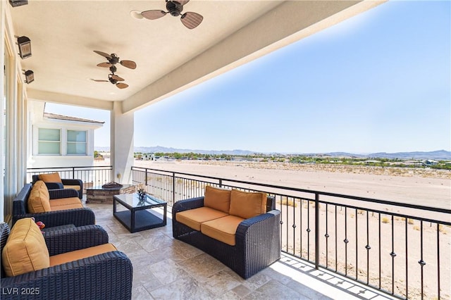 1319 Red Baron Ln, Boulder City, NV 89005 - balcony with ceiling fan, an outdoor living space, and a mountain view