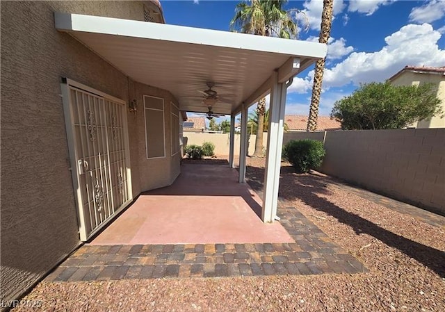 5121 Backwoodsman Ave, Las Vegas, NV 89130 - fenced backyard with ceiling fan and a patio area