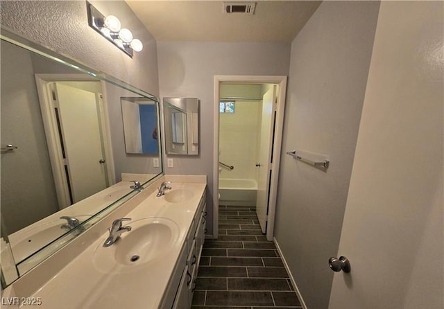 5121 Backwoodsman Ave, Las Vegas, NV 89130 - full bath featuring double vanity and tile patterned floors