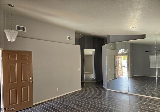 5121 Backwoodsman Ave, Las Vegas, NV 89130 - unfurnished living room featuring a chandelier and wood finish floors
