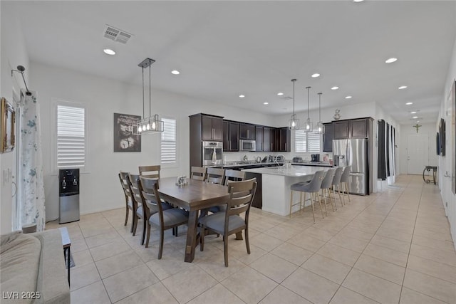 10181 Mount Harlow Ct, Las Vegas, NV 89141 - dining area featuring plenty of natural light, light tile patterned flooring, recessed lighting, and a chandelier