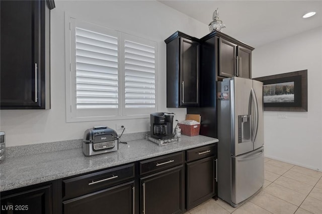 10181 Mount Harlow Ct, Las Vegas, NV 89141 - kitchen with stainless steel fridge with ice dispenser and light tile patterned flooring