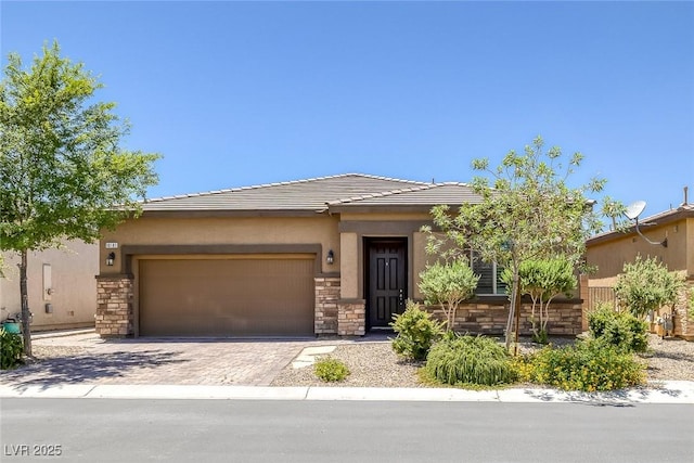10181 Mount Harlow Ct, Las Vegas, NV 89141 - view of front of property with stone siding, an attached garage, stucco siding, and decorative driveway
