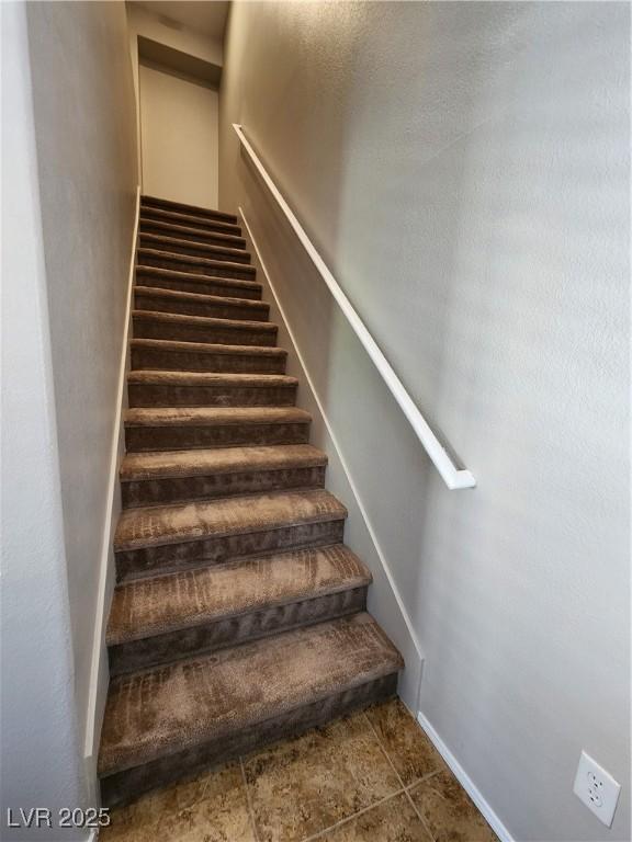 10231 Deerfield Beach Ave Unit 104, Las Vegas, NV 89129 - stairway with tile patterned flooring