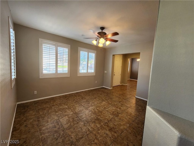 10231 Deerfield Beach Ave Unit 104, Las Vegas, NV 89129 - spare room with ceiling fan and baseboards