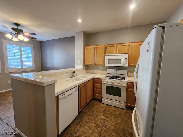 10231 Deerfield Beach Ave Unit 104, Las Vegas, NV 89129 - kitchen featuring white appliances, a peninsula, tile counters, a ceiling fan, and recessed lighting