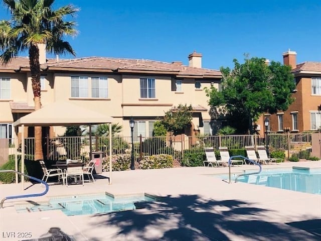10231 Deerfield Beach Ave Unit 104, Las Vegas, NV 89129 - community pool with a gazebo and a patio area