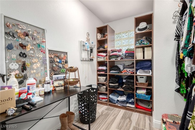 7135 Polaris Ave, Las Vegas, NV 89118 - spacious closet featuring wood finished floors