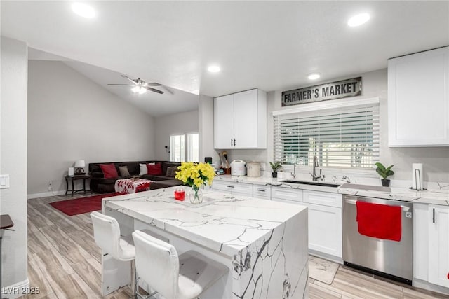 7135 Polaris Ave, Las Vegas, NV 89118 - kitchen featuring dishwasher, a ceiling fan, open floor plan, white cabinets, and recessed lighting