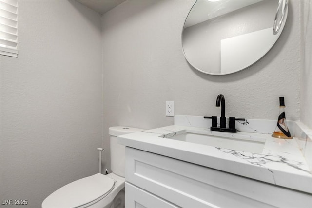 7135 Polaris Ave, Las Vegas, NV 89118 - bathroom featuring vanity and toilet