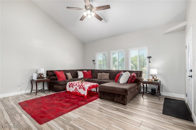 7135 Polaris Ave, Las Vegas, NV 89118 - living room featuring a ceiling fan, light wood-style floors, and high vaulted ceiling