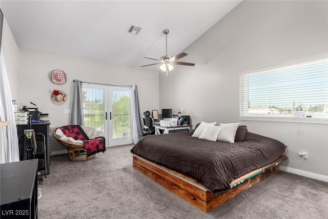 7135 Polaris Ave, Las Vegas, NV 89118 - bedroom featuring access to outside, multiple windows, carpet flooring, and vaulted ceiling