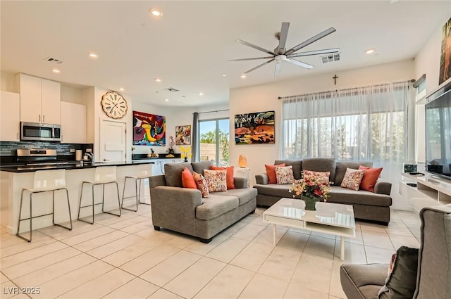 3194 Lumassina Way, Henderson, NV 89044 - living room featuring a ceiling fan, light tile patterned floors, and recessed lighting