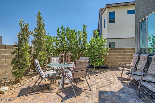 3194 Lumassina Way, Henderson, NV 89044 - fenced backyard featuring a patio area and outdoor dining space