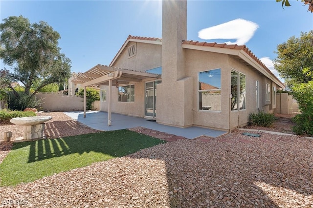 1908 Summit Pointe Dr, Las Vegas, NV 89117 - rear view of property featuring a pergola, a patio, a fenced backyard, and a tiled roof