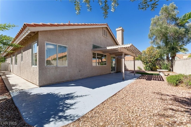 1908 Summit Pointe Dr, Las Vegas, NV 89117 - rear view of property with a patio area, a pergola, stucco siding, a fenced backyard, and a chimney