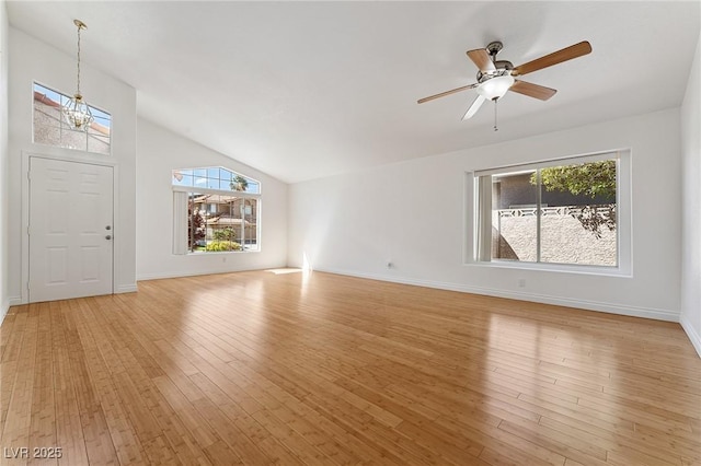 1908 Summit Pointe Dr, Las Vegas, NV 89117 - unfurnished living room featuring healthy amount of natural light, light wood-type flooring, ceiling fan, and vaulted ceiling