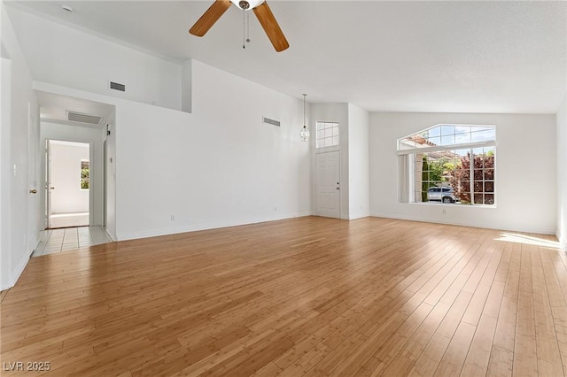 1908 Summit Pointe Dr, Las Vegas, NV 89117 - unfurnished living room with a ceiling fan, healthy amount of natural light, and light wood finished floors