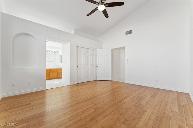 1908 Summit Pointe Dr, Las Vegas, NV 89117 - unfurnished bedroom with high vaulted ceiling, light wood-type flooring, connected bathroom, a ceiling fan, and a closet