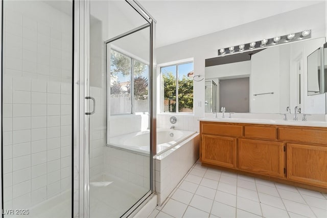 1908 Summit Pointe Dr, Las Vegas, NV 89117 - full bathroom with a garden tub, double vanity, a stall shower, and tile patterned floors