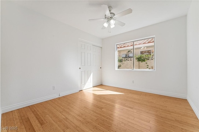 1908 Summit Pointe Dr, Las Vegas, NV 89117 - unfurnished bedroom featuring light wood finished floors and a ceiling fan