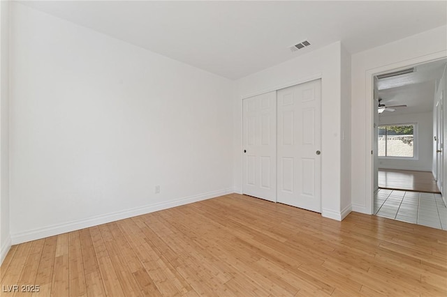 1908 Summit Pointe Dr, Las Vegas, NV 89117 - unfurnished bedroom featuring light wood-style flooring and a closet
