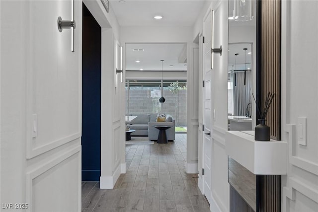 9617 Sard Ln, Las Vegas, NV 89143 - hallway featuring light wood-style floors and recessed lighting