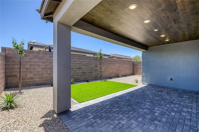 9617 Sard Ln, Las Vegas, NV 89143 - fenced backyard featuring a patio area