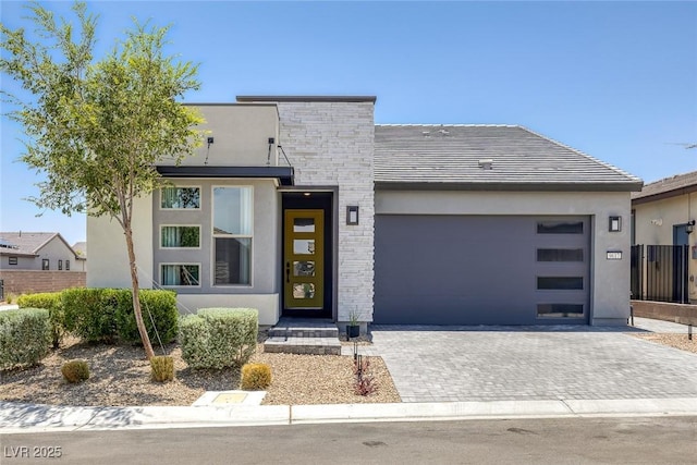 9617 Sard Ln, Las Vegas, NV 89143 - contemporary house featuring stucco siding, driveway, and a garage