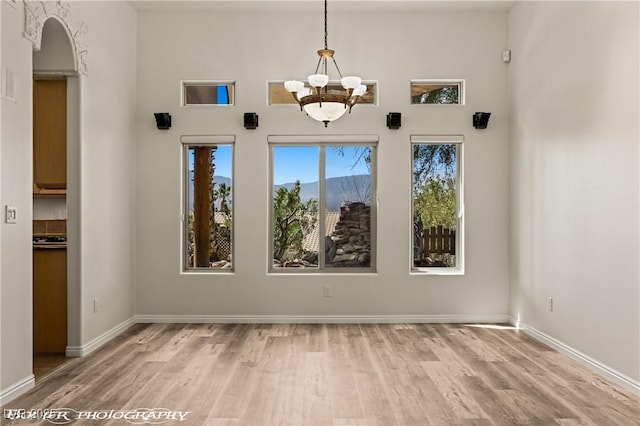 920 Vista Del Sol Ct, Mesquite, NV 89027 - unfurnished dining area with wood finished floors and a chandelier