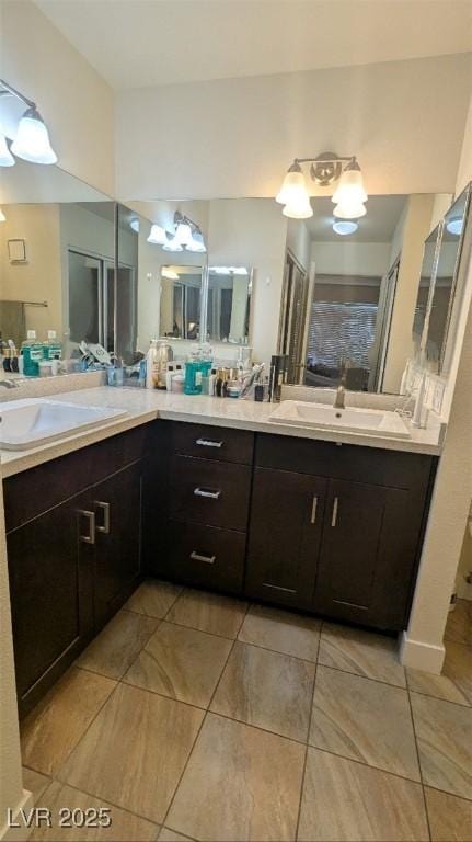 4877 S Torrey Pines Dr Unit 104, Las Vegas, NV 89103 - full bath with double vanity and tile patterned flooring
