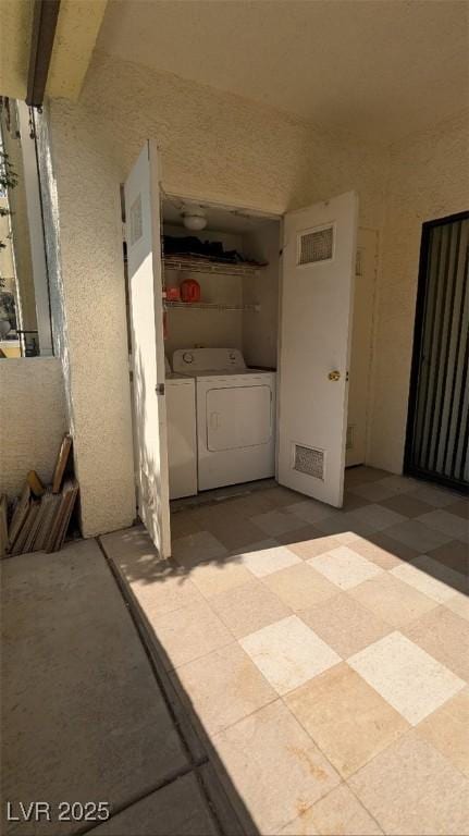 4877 S Torrey Pines Dr Unit 104, Las Vegas, NV 89103 - view of patio featuring washer and clothes dryer
