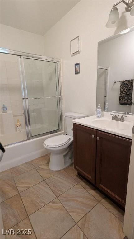 4877 S Torrey Pines Dr Unit 104, Las Vegas, NV 89103 - full bath featuring vanity, tile patterned floors, enclosed tub / shower combo, and vaulted ceiling