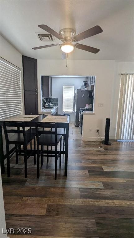 4877 S Torrey Pines Dr Unit 104, Las Vegas, NV 89103 - dining room featuring a ceiling fan and wood finished floors
