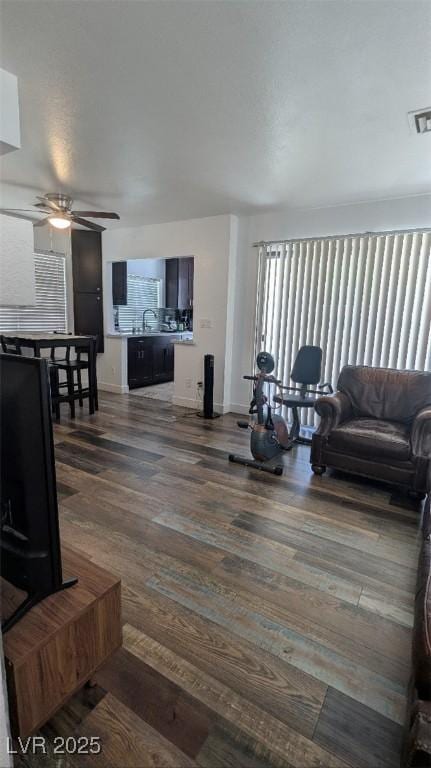 4877 S Torrey Pines Dr Unit 104, Las Vegas, NV 89103 - living area with a ceiling fan and dark wood-type flooring