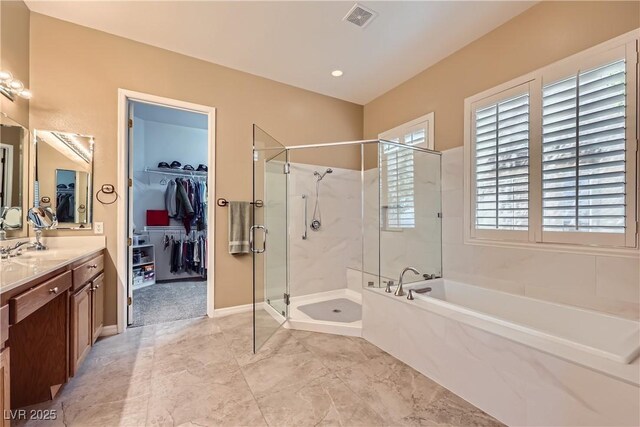 1637 Wellington Springs Ave, Henderson, NV 89052 - full bath with a bath, a shower stall, vanity, and a walk in closet