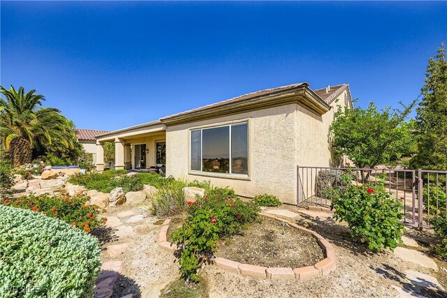 1637 Wellington Springs Ave, Henderson, NV 89052 - back of property with stucco siding