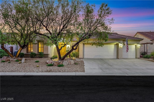 1637 Wellington Springs Ave, Henderson, NV 89052 - view of front of house with driveway, a garage, stucco siding, and a tile roof