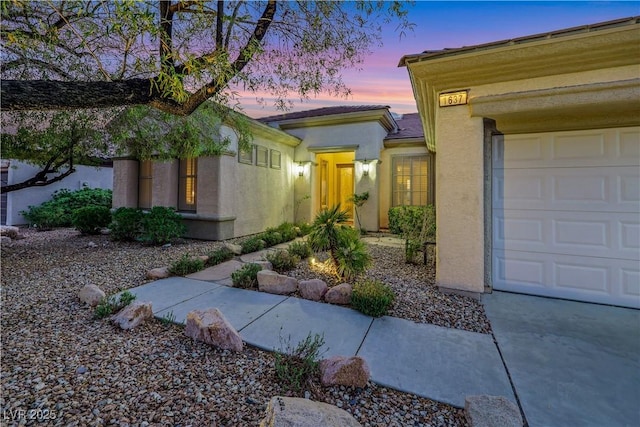 1637 Wellington Springs Ave, Henderson, NV 89052 - entrance to property with stucco siding and an attached garage