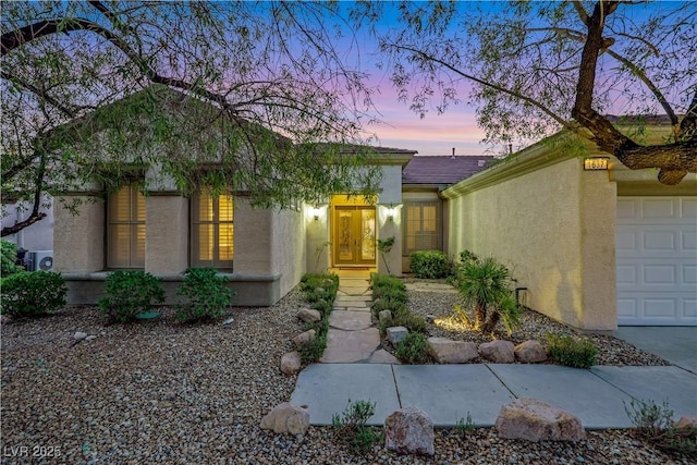 1637 Wellington Springs Ave, Henderson, NV 89052 - view of front facade with stucco siding and an attached garage
