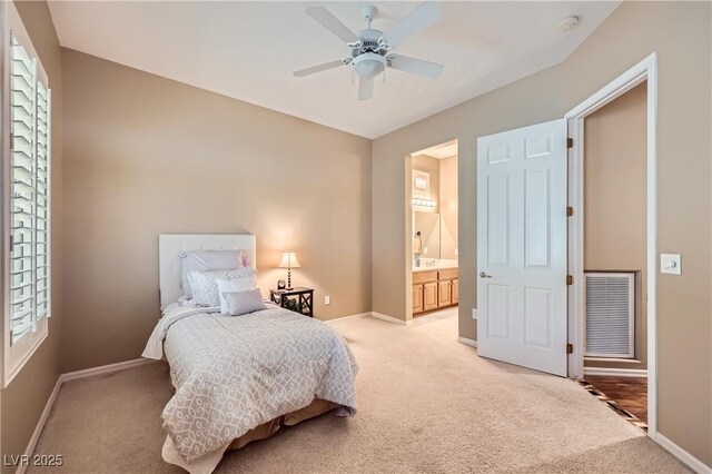 1637 Wellington Springs Ave, Henderson, NV 89052 - bedroom featuring light carpet, a ceiling fan, and ensuite bath