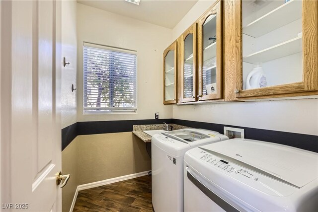 1637 Wellington Springs Ave, Henderson, NV 89052 - washroom with washing machine and clothes dryer and dark wood-style flooring