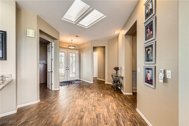 1637 Wellington Springs Ave, Henderson, NV 89052 - entryway with dark wood-type flooring, french doors, and a skylight