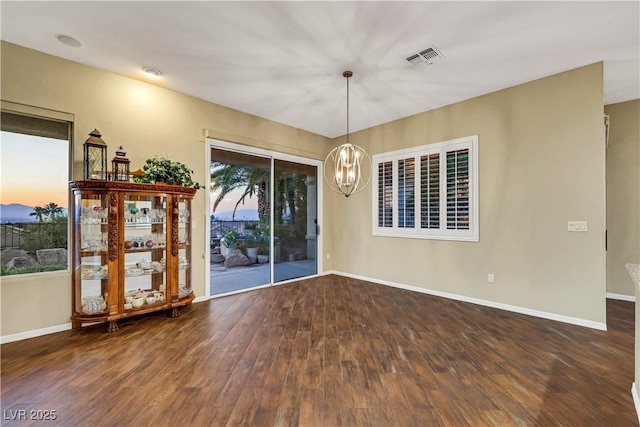 1637 Wellington Springs Ave, Henderson, NV 89052 - unfurnished room featuring wood finished floors and a chandelier