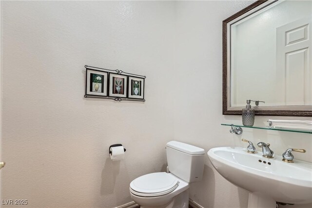 1637 Wellington Springs Ave, Henderson, NV 89052 - half bath with a sink and toilet
