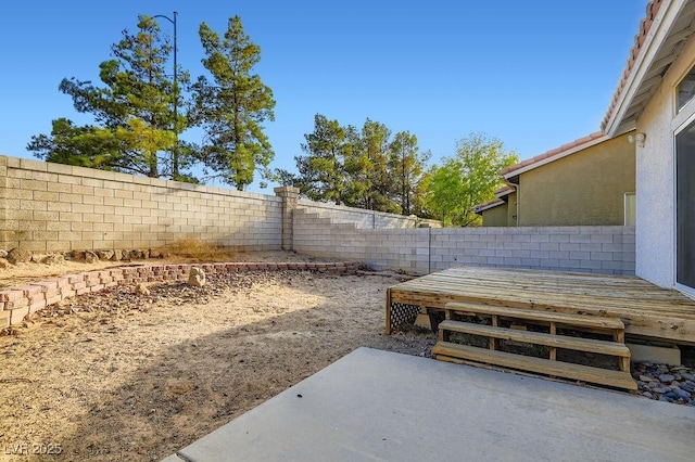 1547 Balsam Mist Ave, Las Vegas, NV 89183 - fenced backyard with a patio area and a wooden deck